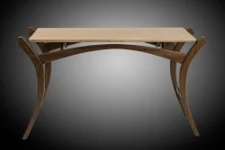 A modern wooden table with curved legs and a light-colored rectangular tabletop, set against a gradient background.